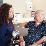 Speech Therapy Caregiver explaining to a Passy Muir Valve User