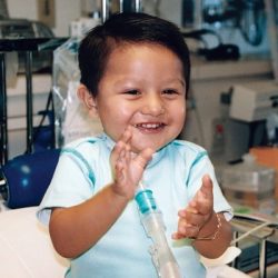 Keys to Success: A Pediatric Respiratory Therapy Case Study Baby clapping his hands with a PMV007 inline