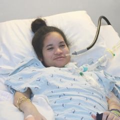 Current Research Related to Mechanical Ventilation and Speaking Valve Use Doctor adjusting patient's trach