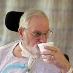 Current Research Related to Mechanical Ventilation and Speaking Valve Use Doctor adjusting patient's trach